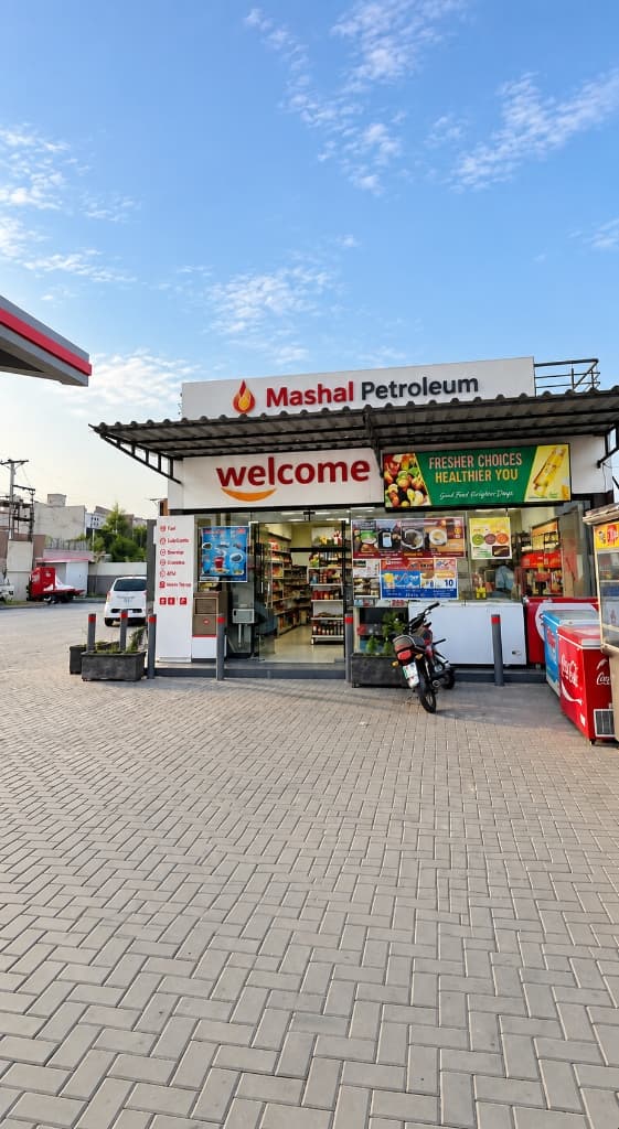 Mashaal Petroleum Welcome 24/7 convenience mart with cold drinks, snacks, and travel goods