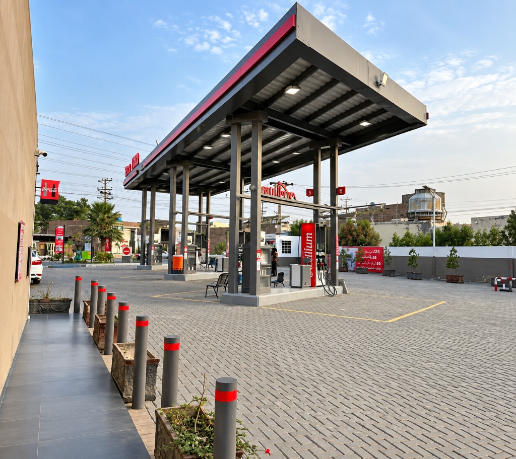 Mashaal Total PARCO station daytime forecourt with high-clearance canopy and Excellium dispenser islands in Rahim Yar Khan