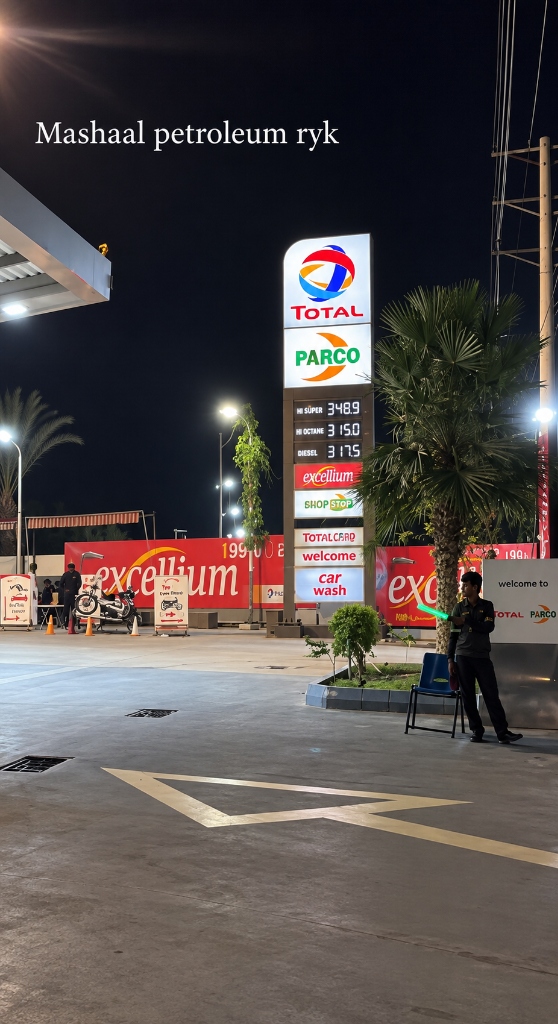 Total PARCO illuminated totem price board at night showing Hi Super, Hi Octane, Diesel, Excellium, and car wash